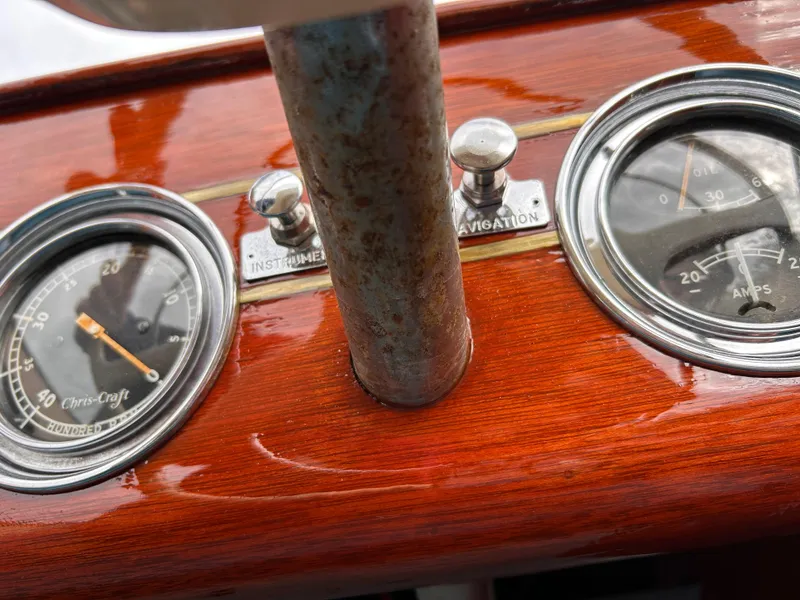 Slide: The Image of Close-up of 1953 Chris-Craft 22 Sportsman dashboard with vintage gauges and wood finish. - 33
