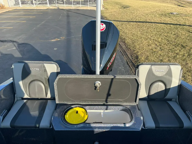 Slide: The Image of 2025 Lund 189 Tyee GL boat interior with seating and storage compartments. - 11