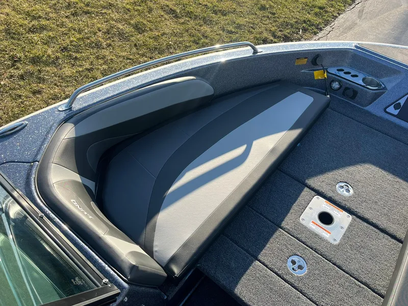 Slide: The Image of 2025 Lund 189 Tyee GL boat interior with cushioned seating and storage compartments. - 15