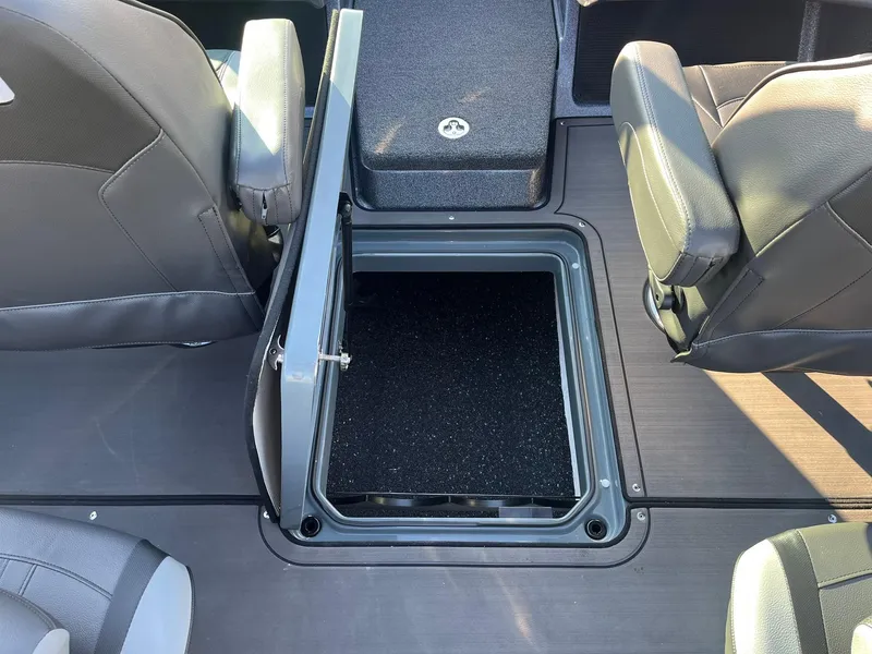 Slide: The Image of 2025 Lund 189 Tyee GL boat interior with open storage compartment. - 24