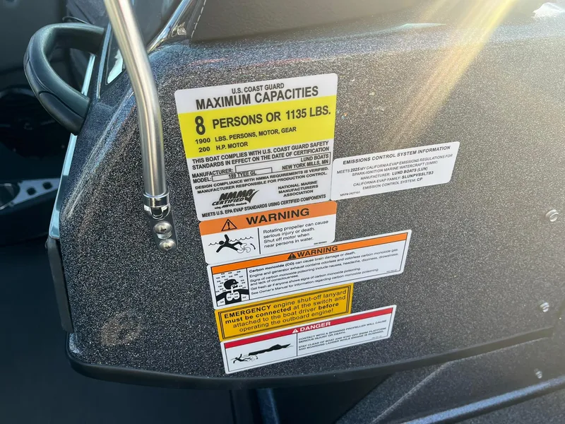 Slide: The Image of 2025 Lund 189 Tyee GL boat capacity and safety warning labels. - 29