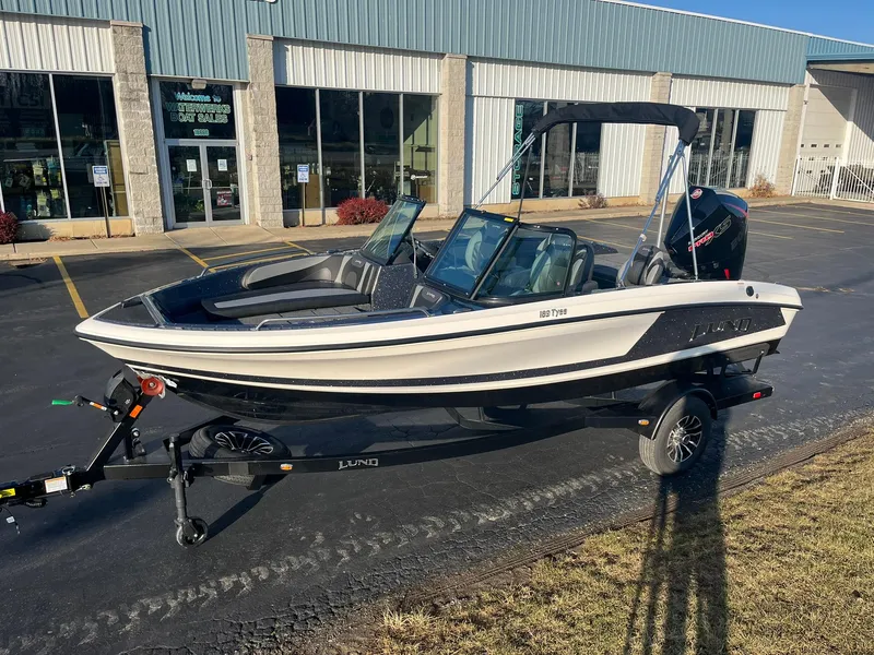 Slide: The Image of 2025 Lund 189 Tyee GL boat on trailer outside dealership. - 3