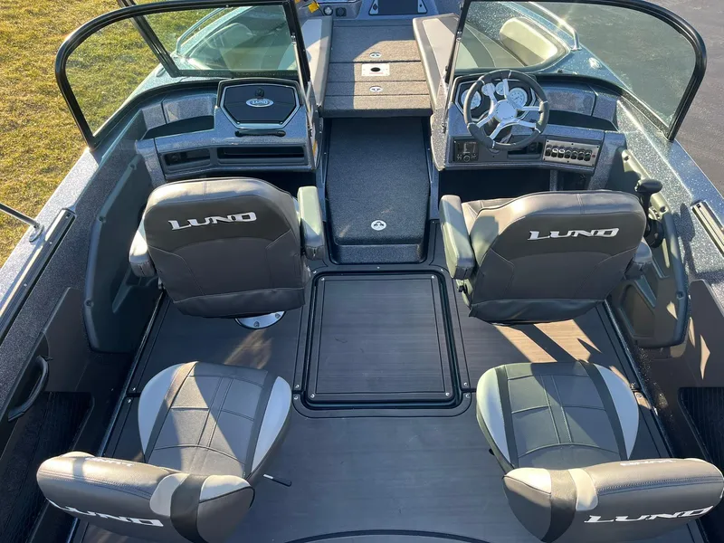 Slide: The Image of Interior of 2025 Lund 189 Tyee GL boat with four seats and steering console. - 7