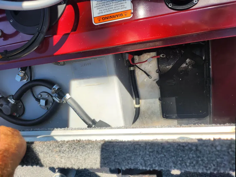 Slide: The Image of 2018 Tracker Pro 170 boat interior showing wiring and battery compartment. - 22