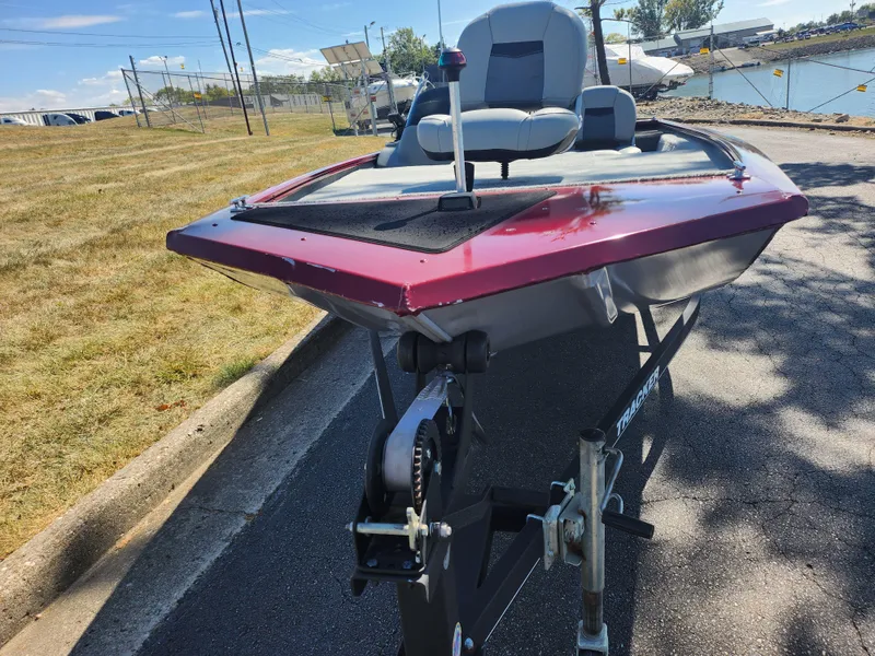 Slide: The Image of 2018 Tracker Pro 170 boat on trailer, parked near a waterfront. - 6