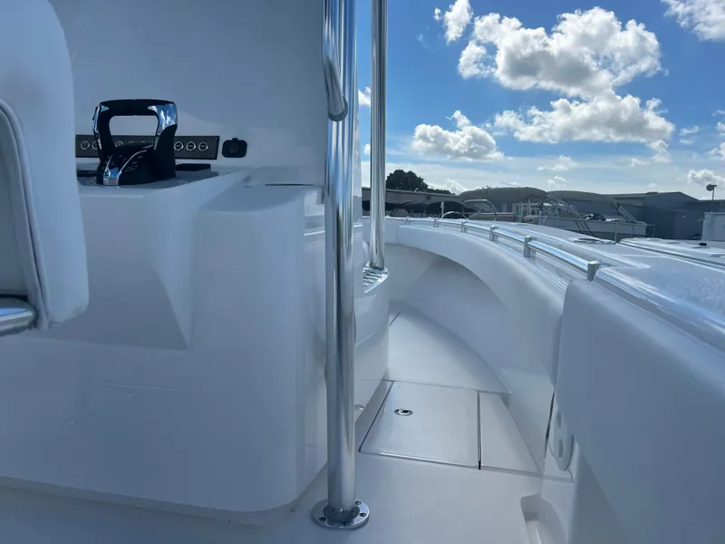 Slide: The Image of 2025 Contender 25T boat deck with clear sky and clouds. - 10