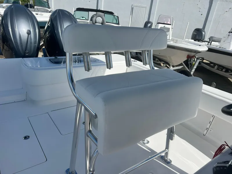 Slide: The Image of Contender 25T 2025 boat with dual engines and white seating. - 12