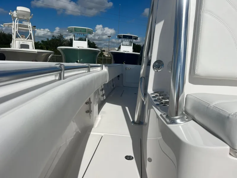 Slide: The Image of 2025 Contender 25T boat interior with sleek white design and stainless steel accents. - 13