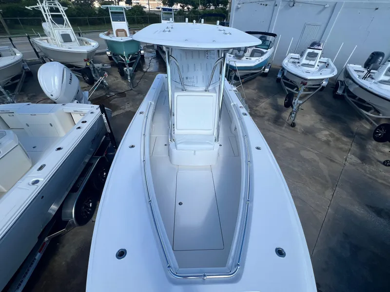 Slide: The Image of Contender 25T 2025 model boat, aerial view in a marina setting. - 14