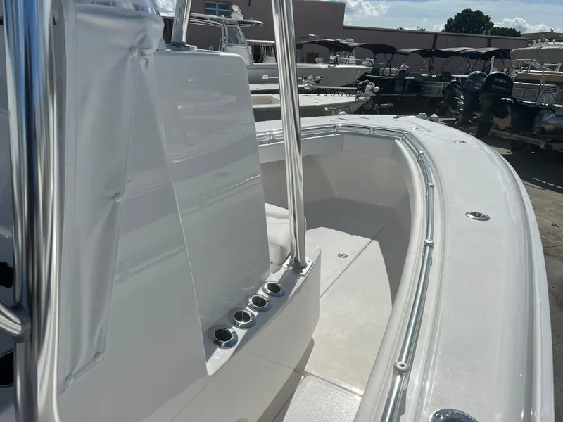 Slide: The Image of 2025 Contender 25T boat interior with sleek design and rod holders. - 15