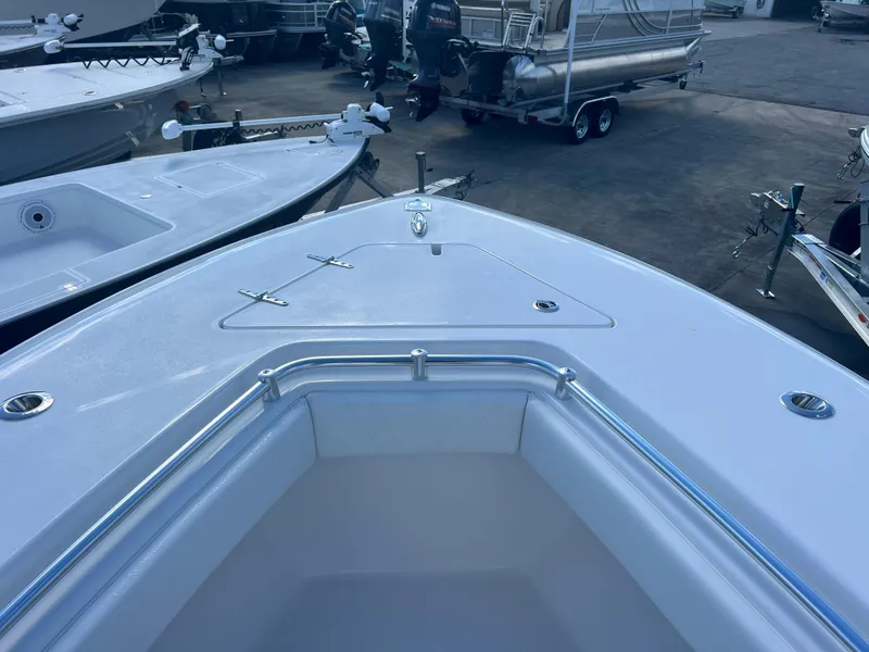Slide: The Image of 2025 Contender 25T boat bow view in a marina setting. - 9