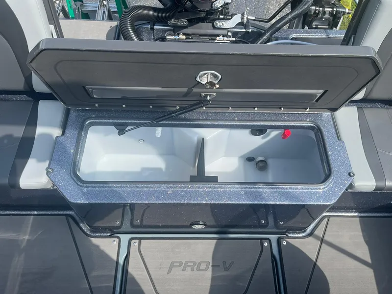 Slide: The Image of Open storage compartment on 2025 Lund 202 Pro-V GL boat deck. - 14