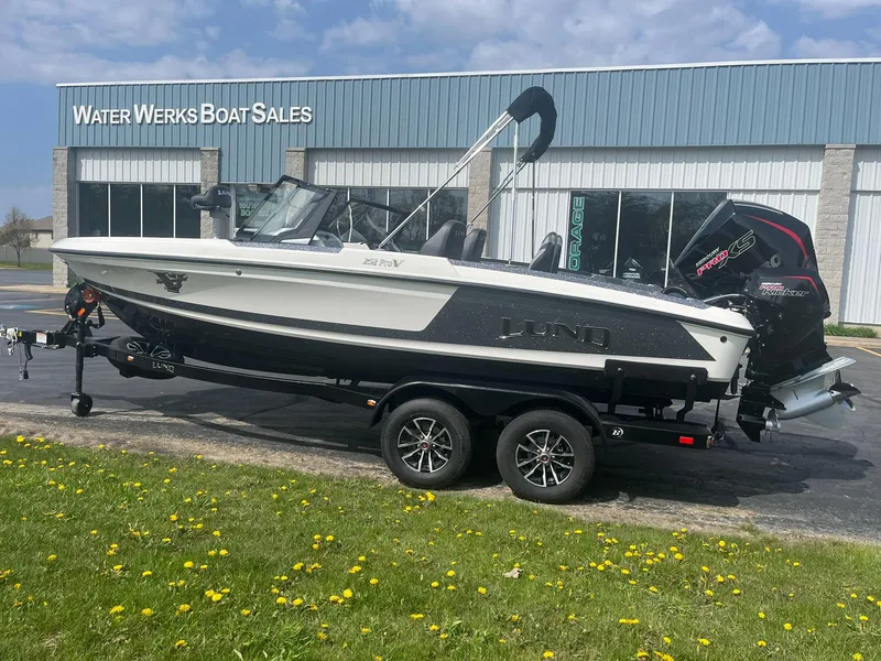 Slide: The Image of 2025 Lund 202 Pro-V GL boat on trailer outside Water Werks Boat Sales. - 3