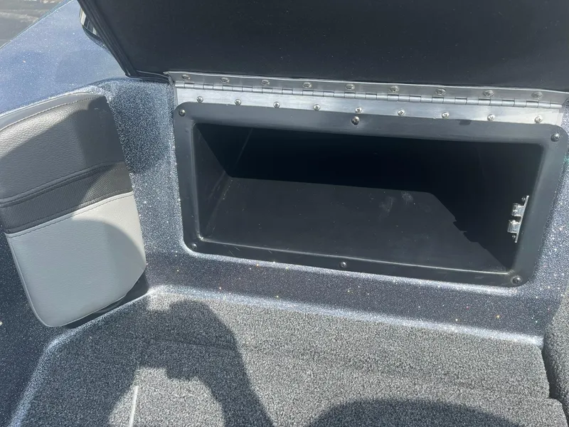 Slide: The Image of Open storage compartment in 2025 Lund 202 Pro-V GL boat. - 31