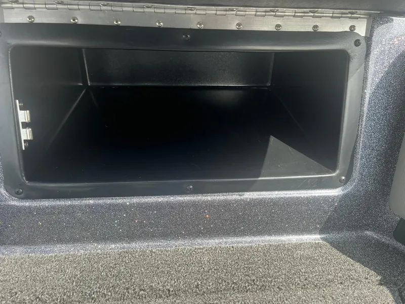 Slide: The Image of Open storage compartment in 2025 Lund 202 Pro-V GL boat. - 32