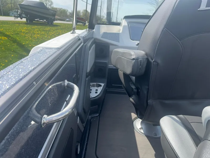 Slide: The Image of 2025 Lund 202 Pro-V GL boat interior with seating and control panel. - 38