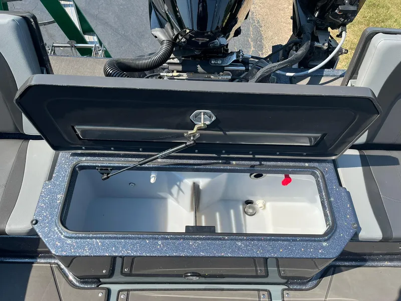 Slide: The Image of Open storage compartment on 2025 Lund 202 Pro-V GL boat, showcasing interior space. - 18