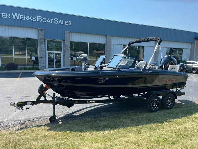 Slide: The Image of 2025 Lund 202 Pro-V GL boat on trailer outside Water Werks Boat Sales. - 2