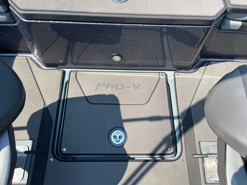 Slide: The Image of 2025 Lund 202 Pro-V GL boat deck with "Pro-V" branding, featuring sleek design and seating. - 31