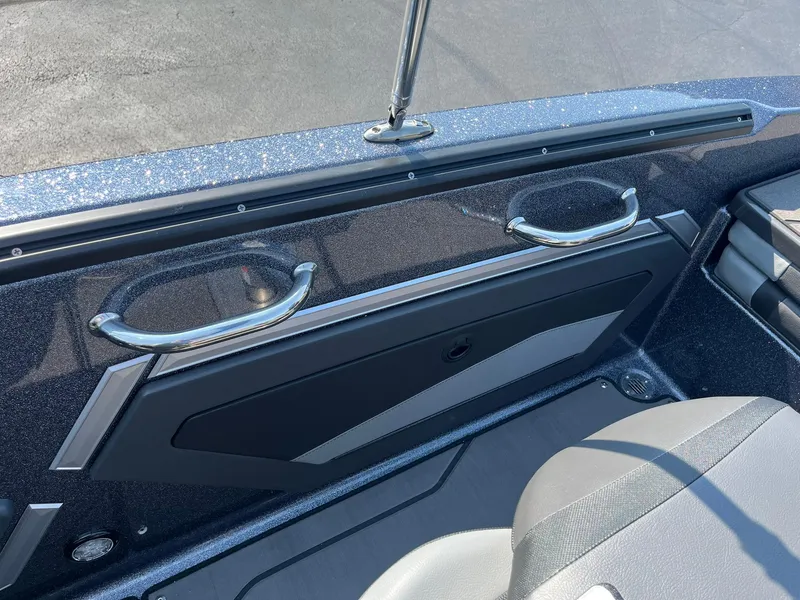 Slide: The Image of 2025 Lund 202 Pro-V GL boat interior with sleek design and metallic accents. - 32