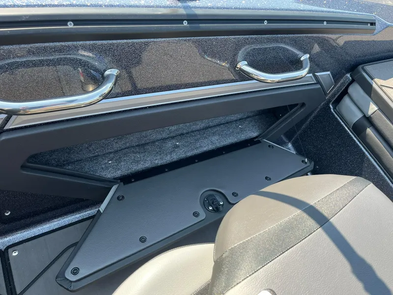 Slide: The Image of 2025 Lund 202 Pro-V GL boat interior with storage compartment and seating. - 33