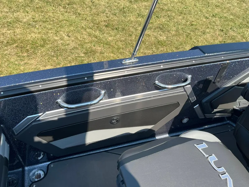 Slide: The Image of 2025 Lund 202 Pro-V GL boat interior with sleek design and comfortable seating. - 34