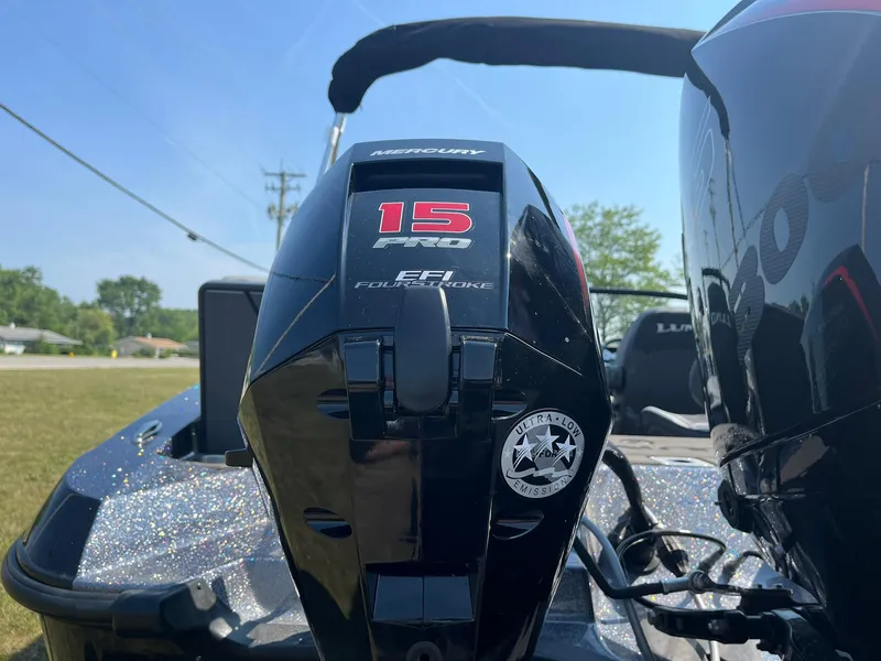 Slide: The Image of Close-up of a 2025 Lund 202 Pro-V GL boat engine, featuring Mercury 15 Pro EFI FourStroke. - 40