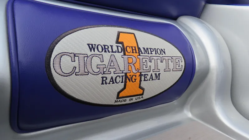 Slide: The Image of 2005 Cigarette 39' Top Gun Unlimited, World Champion Racing Team logo on blue seat. - 17