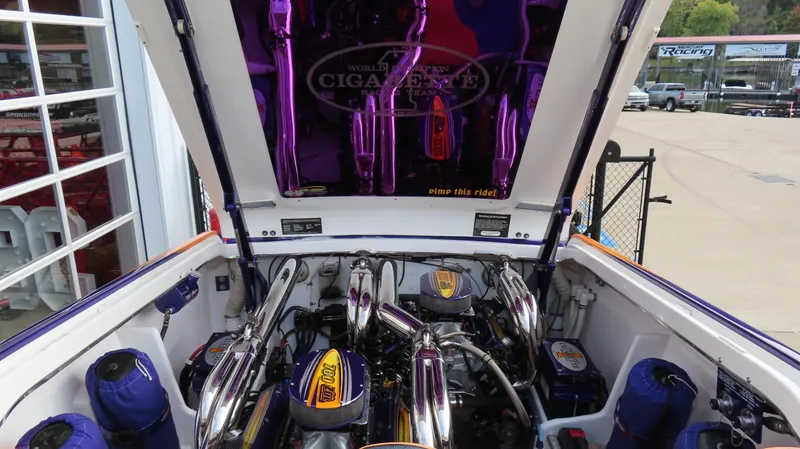 Slide: The Image of Engine compartment of a 2005 Cigarette 39' Top Gun Unlimited boat, showcasing polished components. - 20