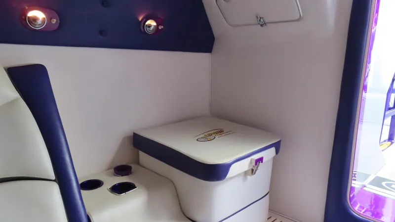 Slide: The Image of Interior of 2005 Cigarette 39' Top Gun Unlimited boat with seating and storage. - 26