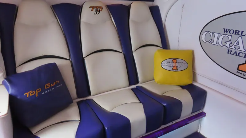 Slide: The Image of Interior seating of 2005 Cigarette 39' Top Gun Unlimited boat with branded cushions. - 29