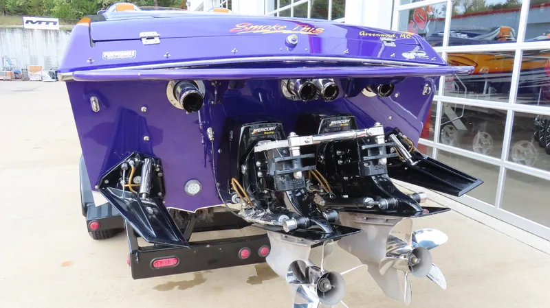 Slide: The Image of 2005 Cigarette 39' Top Gun Unlimited boat, rear view with dual engines and propellers. - 6