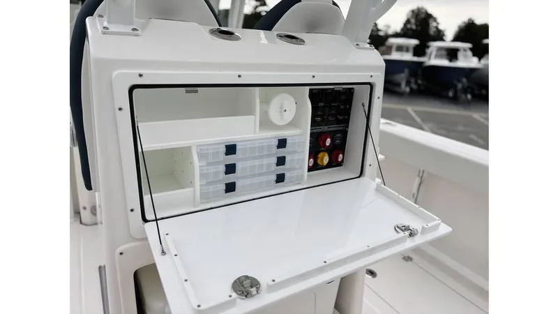 Slide: The Image of 2025 Sea Fox 288 Commander boat console with storage compartments and control panel. - 12