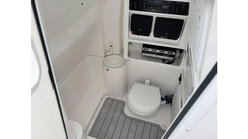 Slide: The Image of 2025 Sea Fox 288 Commander boat interior with toilet and control panel. - 17