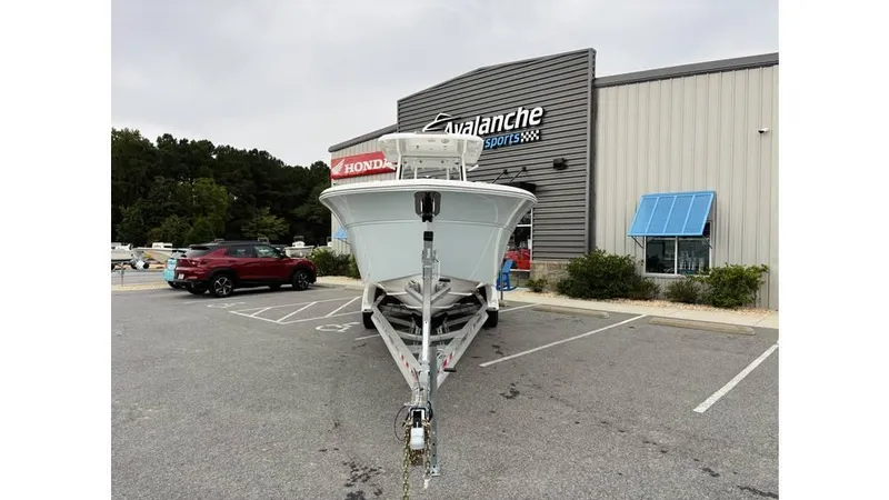 Slide: The Image of 2025 Sea Fox 288 Commander boat on trailer outside dealership. - 2