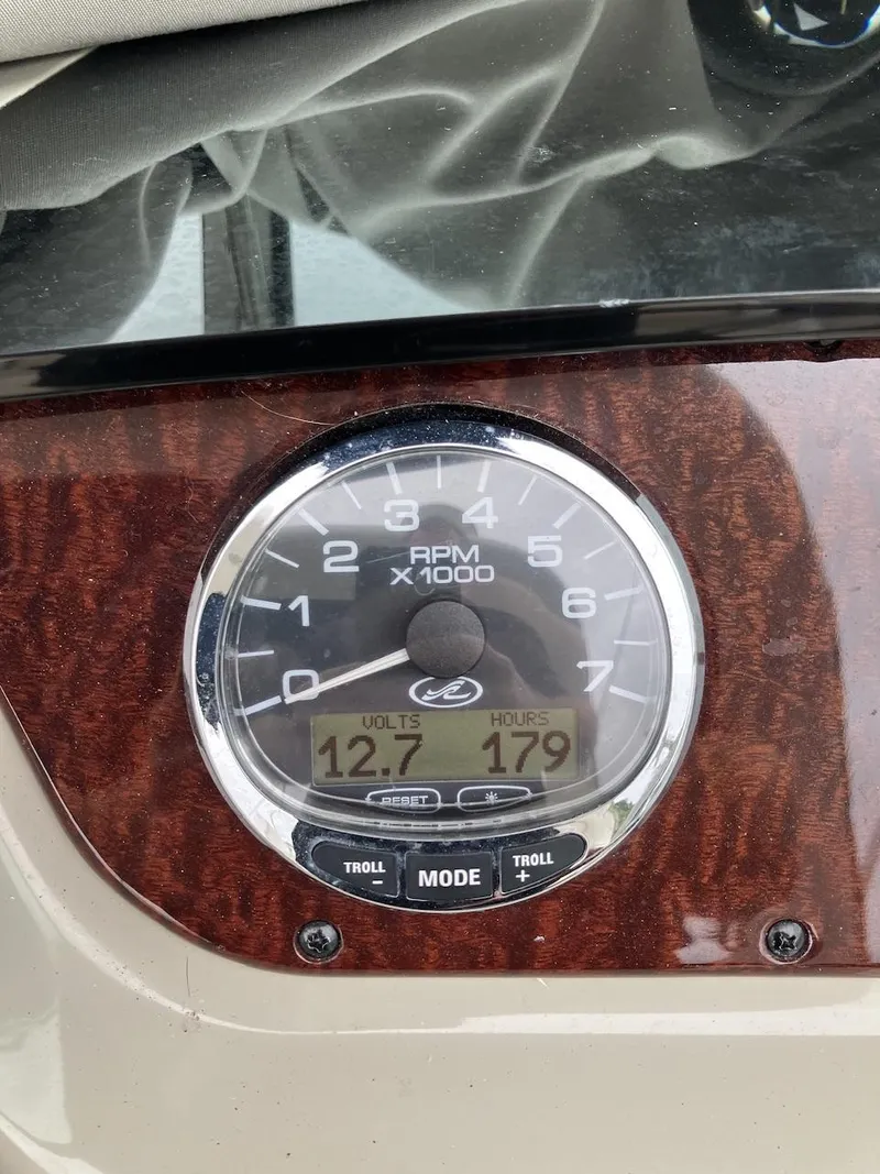 Slide: The Image of Close-up of 2012 Sea Ray 280 Sundancer tachometer displaying RPM, volts, and hours. - 5