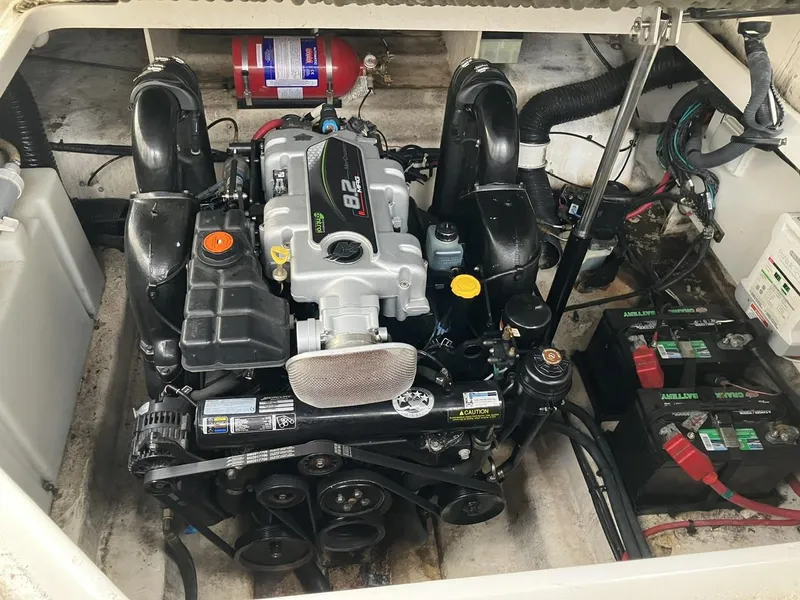 Slide: The Image of Engine compartment of a 2012 Sea Ray 280 Sundancer with visible batteries and fire extinguisher. - 6