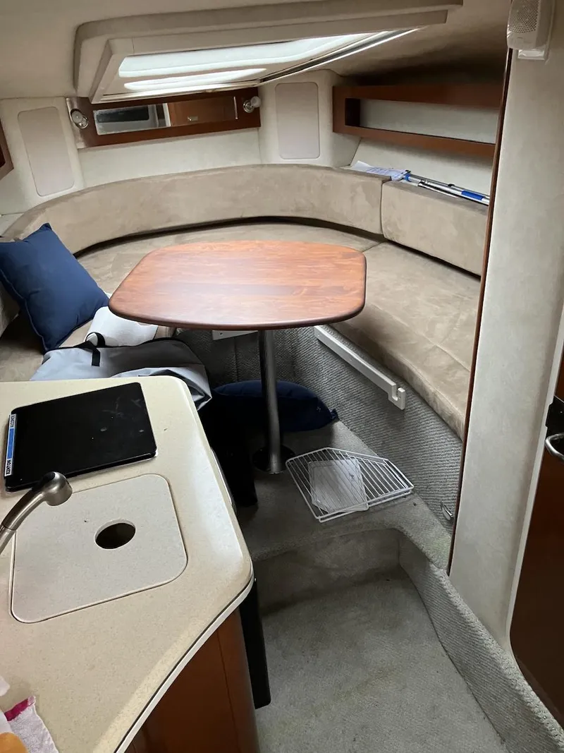 Slide: The Image of Interior of 2012 Sea Ray 280 Sundancer with seating and table. - 9
