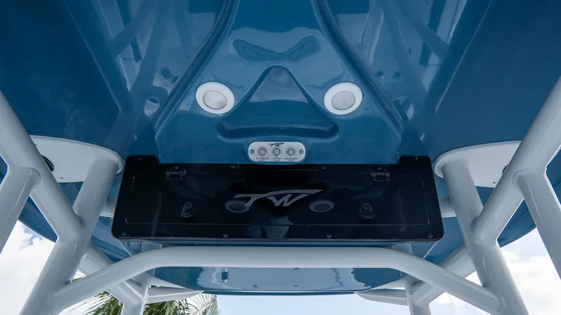 Slide: The Image of 2025 Tidewater 2300 Carolina Bay boat underside with speakers and control panel. - 12
