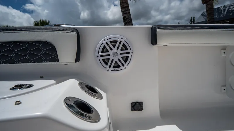 Slide: The Image of 2025 Tidewater 2300 Carolina Bay boat interior with speaker and cup holders. - 20