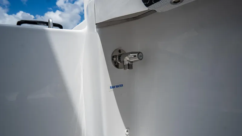 Slide: The Image of 2025 Tidewater 2300 Carolina Bay boat detail with raw water washdown fitting. - 24