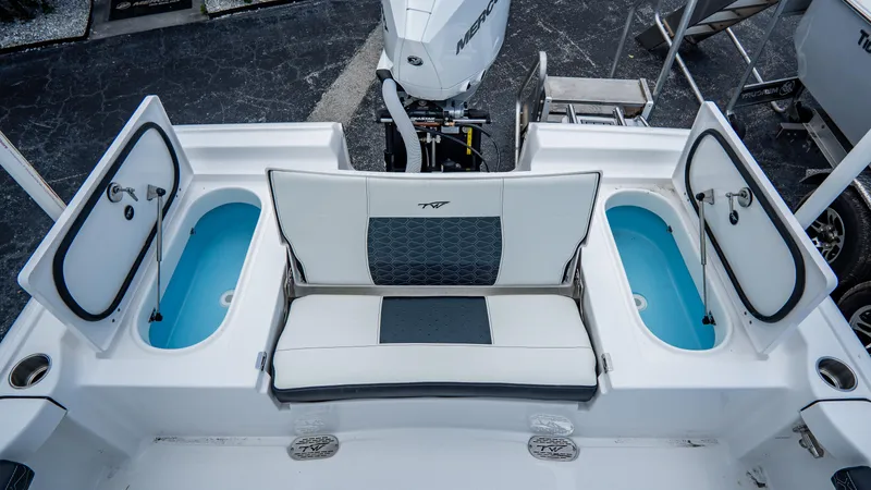 Slide: The Image of 2025 Tidewater 2300 Carolina Bay boat interior with seating and storage compartments. - 7
