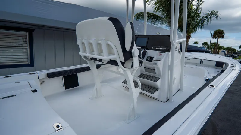Slide: The Image of 2025 Tidewater 2300 Carolina Bay boat interior with helm and seating. - 8