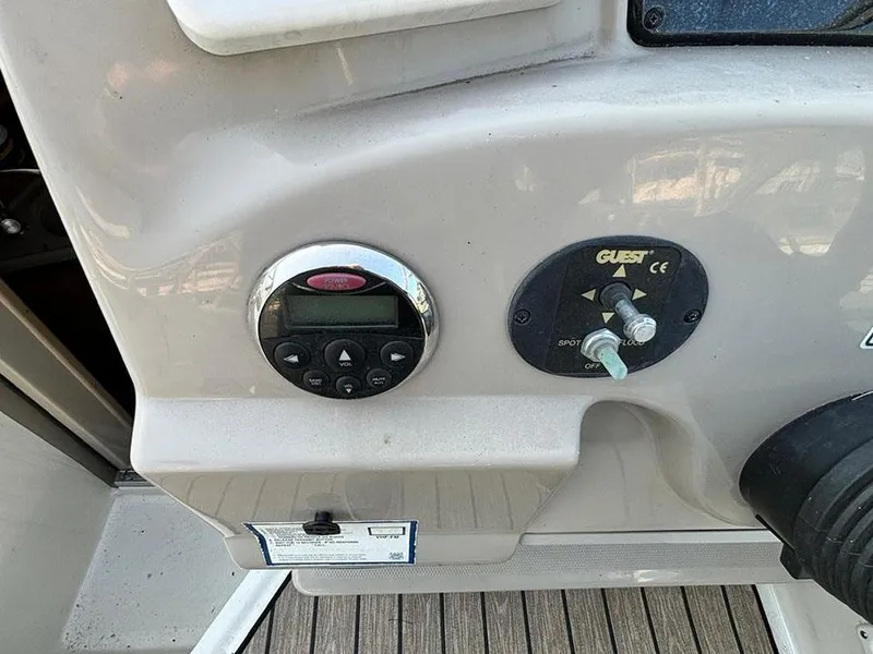 Slide: The Image of Control panel of a 2006 Sea Ray 240 Sundancer boat. - 12