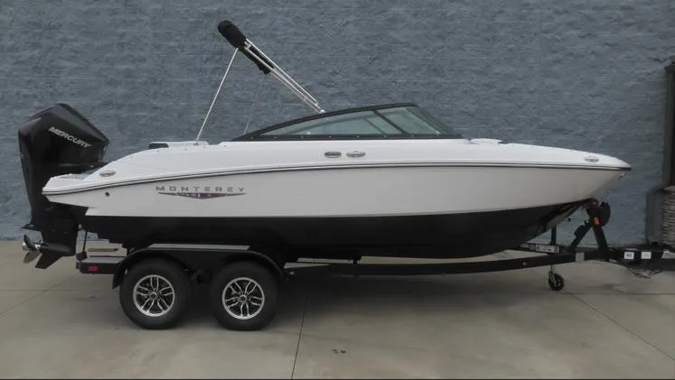 The Image of 2025 Monterey M-205 boat on trailer, white and black design, parked outdoors. - 0