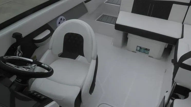 Slide: The Image of Interior of 2025 Monterey M-205 boat with white seating and steering wheel. - 3