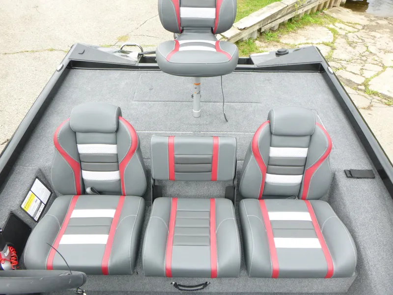Slide: The Image of 2024 Ranger RT188 boat interior with gray and red seating. - 10