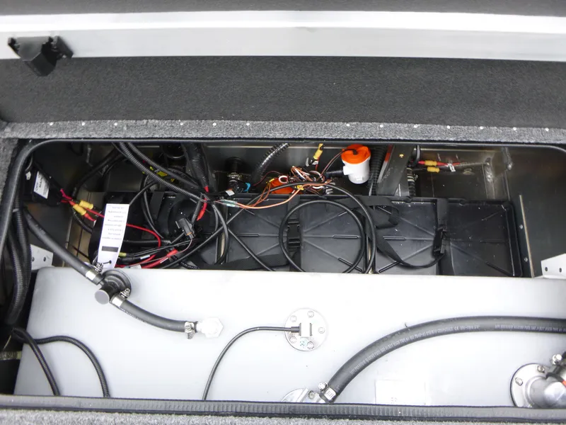 Slide: The Image of 2024 Ranger RT188 boat battery compartment with wiring and components. - 13