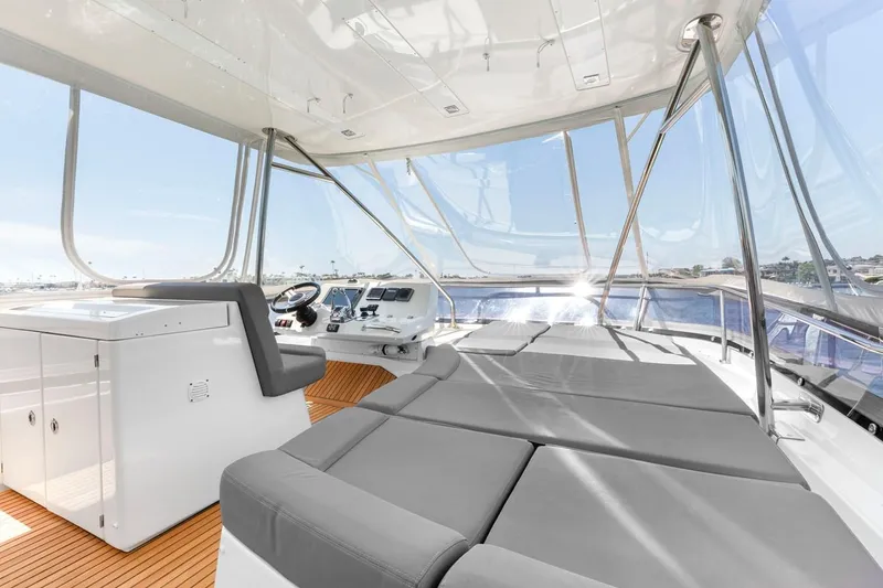 Slide: The Image of Luxurious 2016 Prestige 550 yacht interior with spacious seating and panoramic views. - 13
