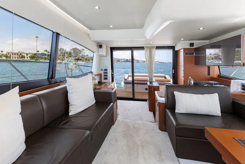Slide: The Image of Luxurious interior of 2016 Prestige 550 yacht with modern furnishings and waterfront view. - 15